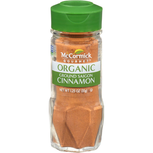Large bulk container of McCormick ground cinnamon 5 lbs with labeling visible