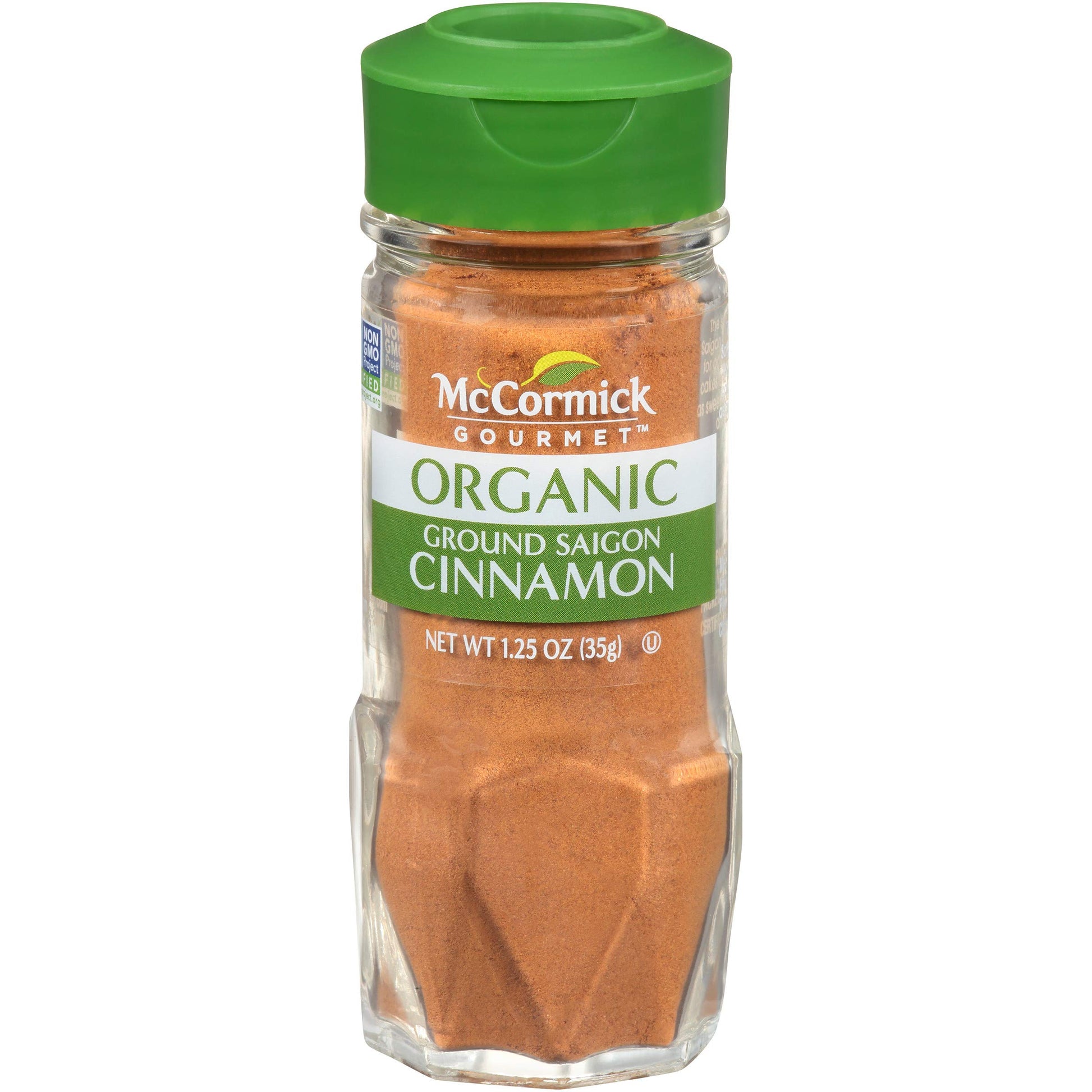 Large bulk container of McCormick ground cinnamon 5 lbs with labeling visible